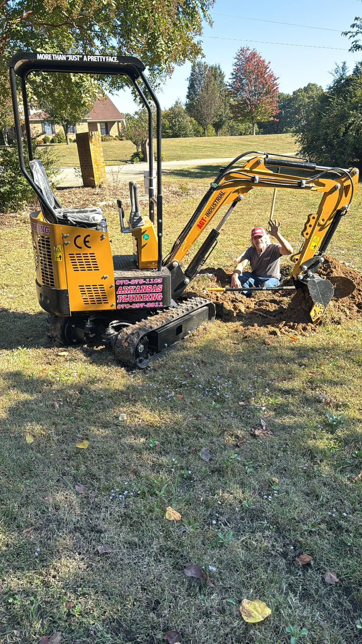 Arkansas Plumbing mini excavator on a residential job with Keith in the trench