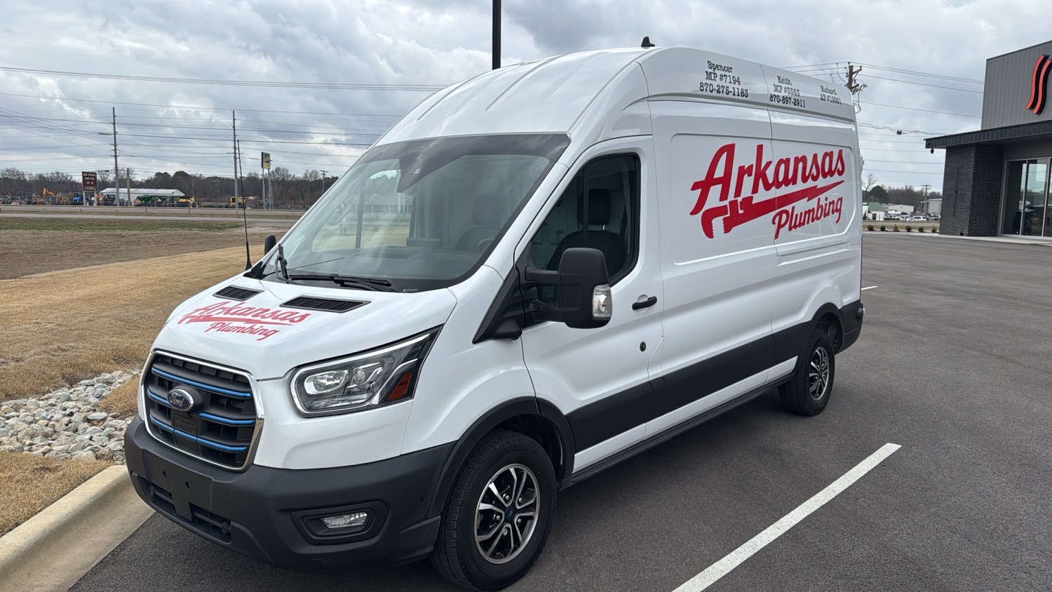 Arkansas Plumbing Ford Transit van with the script logo and pipe wrench on the side